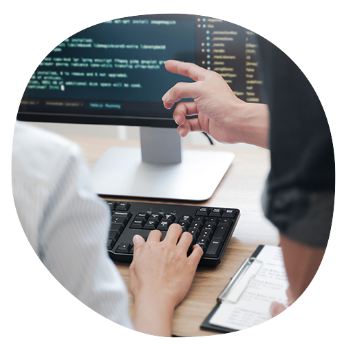 Solutions Engineer working on code with colleague