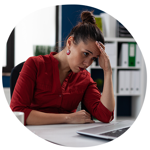 C-Suite looking at laptop, frustrated
